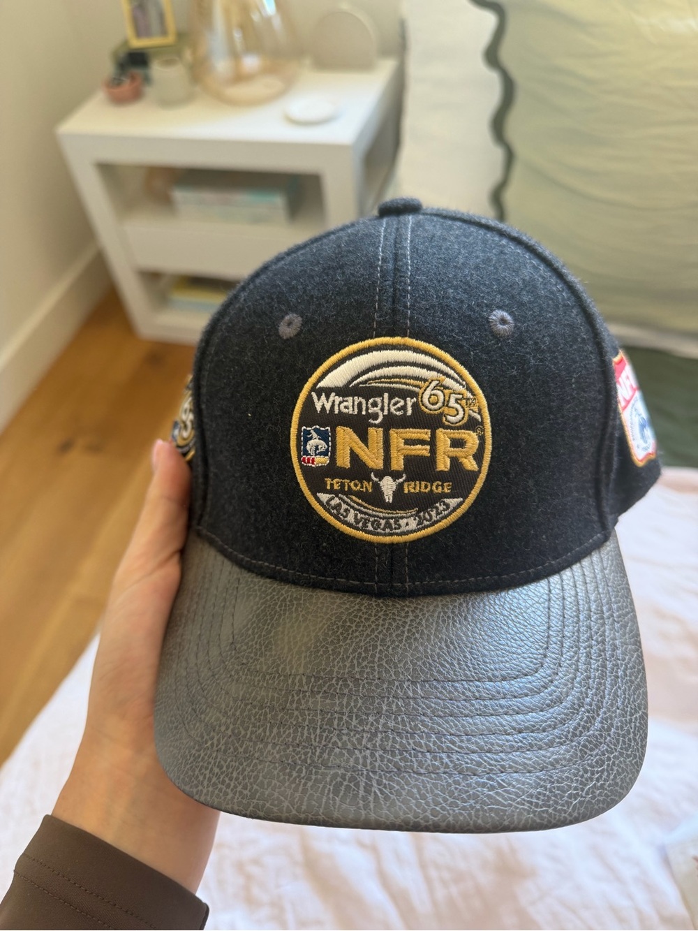 Wrangler NFR Black Wool Cap with Gray Faux-Leather Bill and Gold Patch